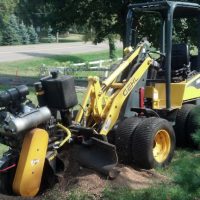 Branch Manager stump grinder being used to grind a stump