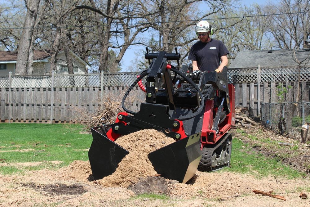 BMG Clamshell Scoops Picking Up Brush Pile