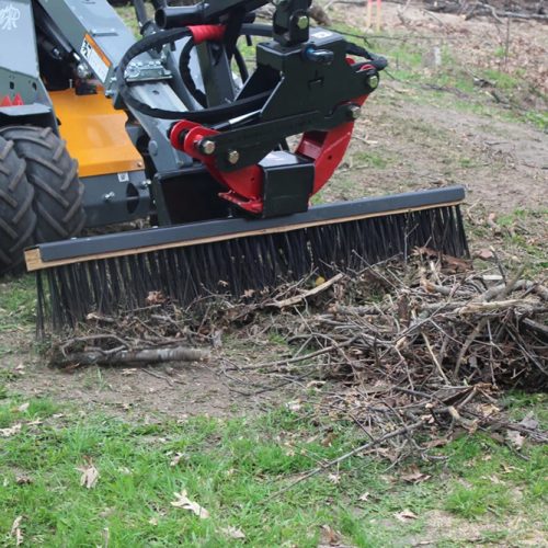 BMG grab rake being used to cleanup loose branches