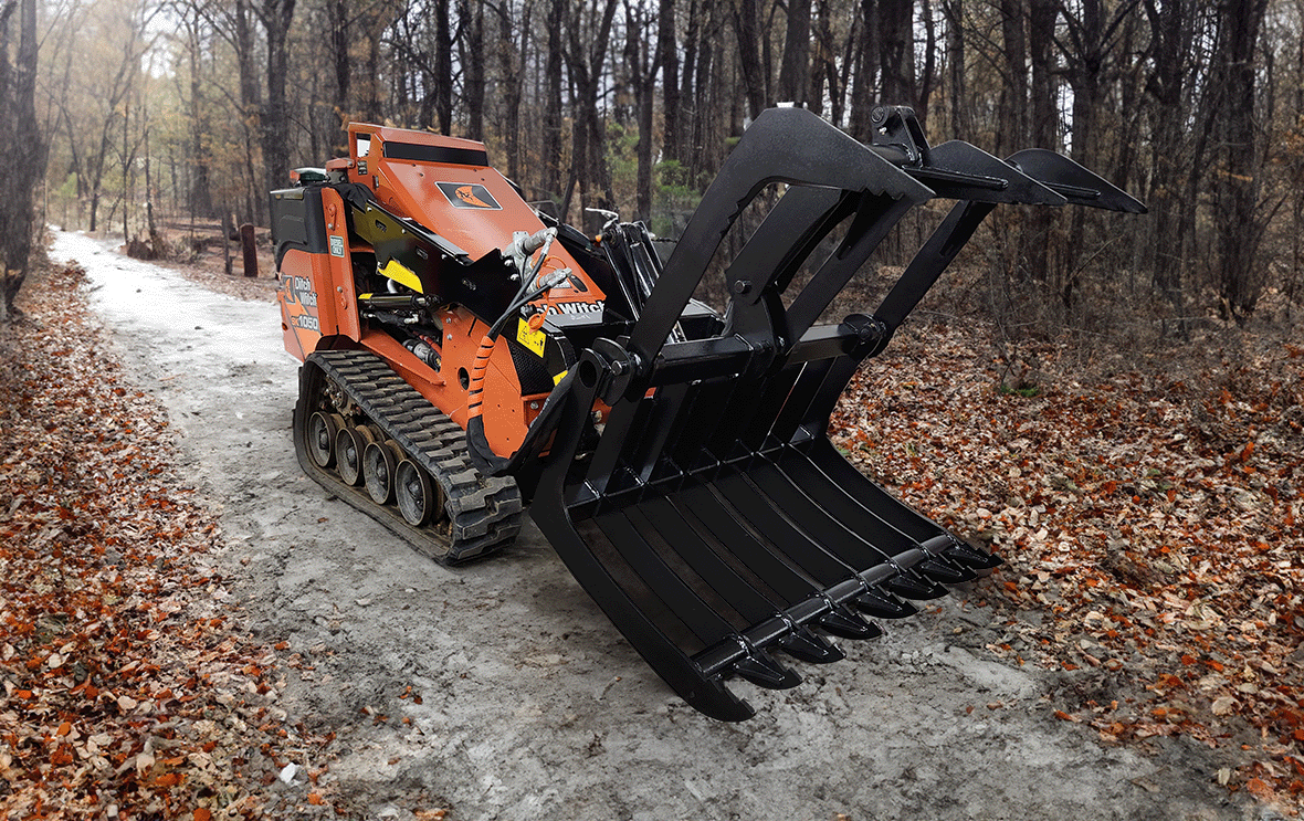Branch Manager Attachments Horizontal Root Grapple For Mini Skids Open on a Ditch Witch SK1050 In a forest